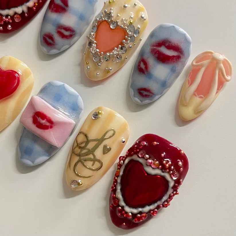 Decorative heart-shaped items with various designs on a light background