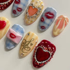 Decorative heart-shaped items with various designs on a light background