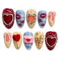 Decorative nail art with hearts and other designs on a white background