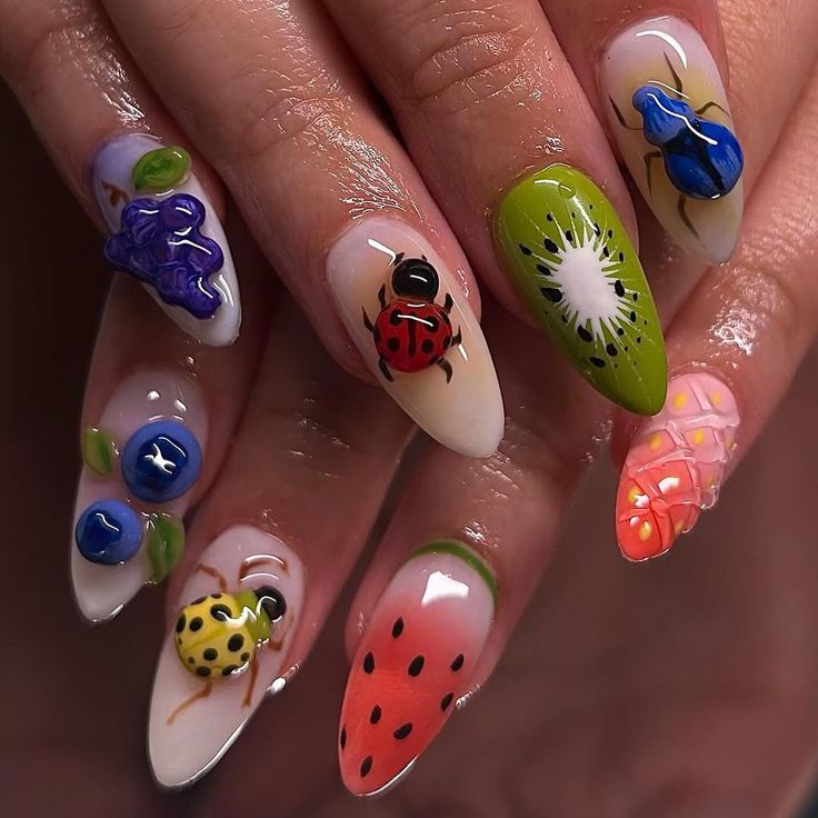 Nails with colorful designs of fruits and insects on a neutral background