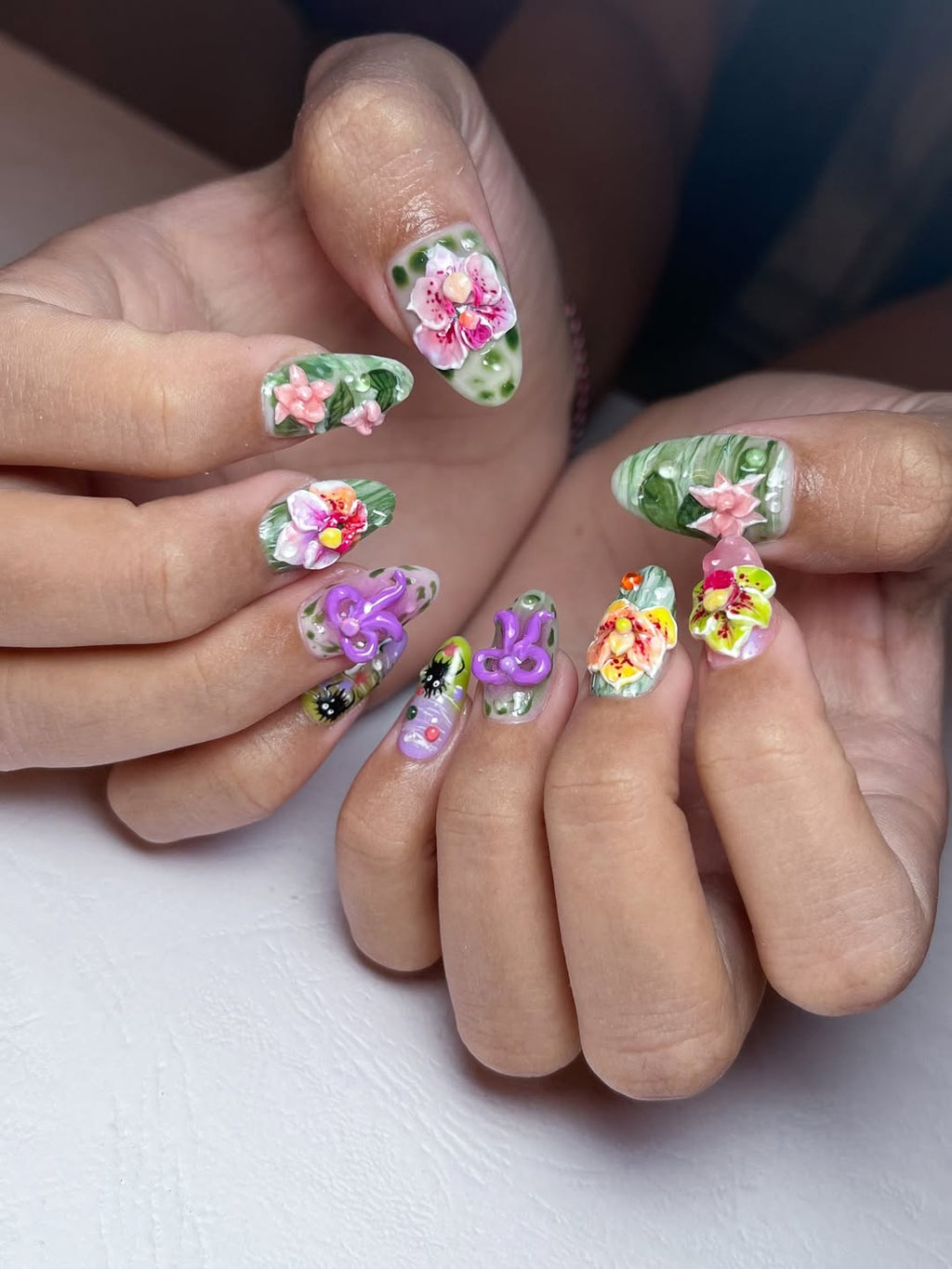 Nails with floral designs on a white background