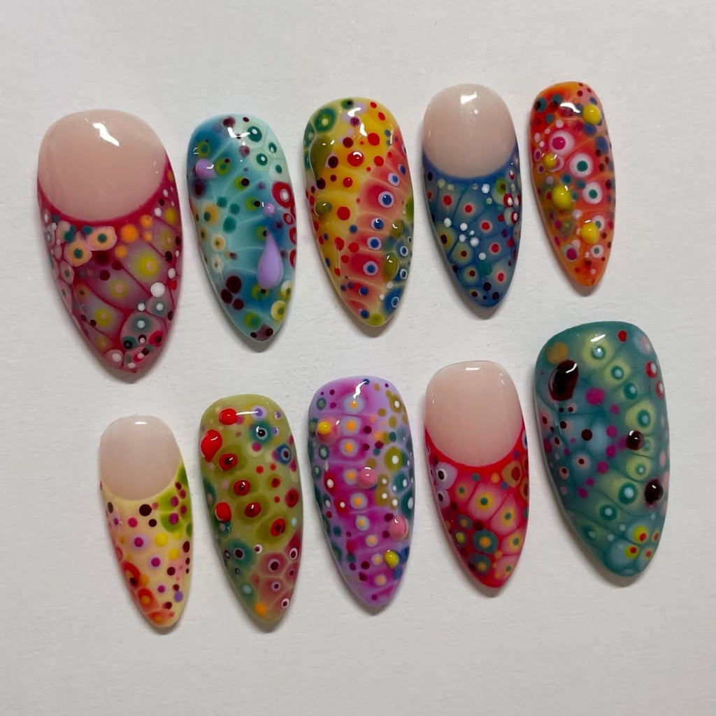 Set of colorful nail art designs on a white background