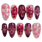 Set of decorative nail art with pink and purple flowers on a white background