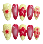 Set of decorative nail art with red and yellow flowers on a white background