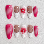 Set of decorative nails with pink, brown, and white colors on a textured white background