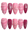 Set of pink and red nail designs with floral and shell decorations on a white background