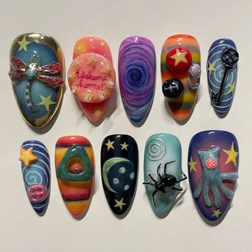horror Colorful nail art designs on a white background